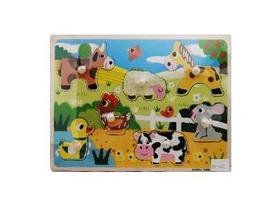 Hand grasping the wooden animal puzzles - OBL806214