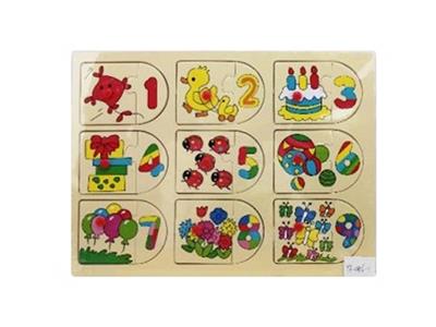 Hand grasping the wooden animal puzzles - OBL806237