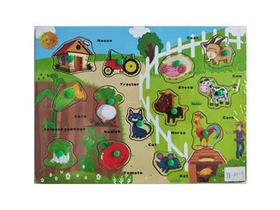 Hand grasping the wooden puzzle farm animals - OBL806244