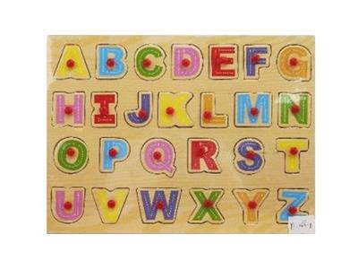 Puzzle hand grasping the wooden capital letters - OBL806381