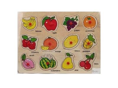 Hand grasping the wooden fruit puzzles - OBL806438